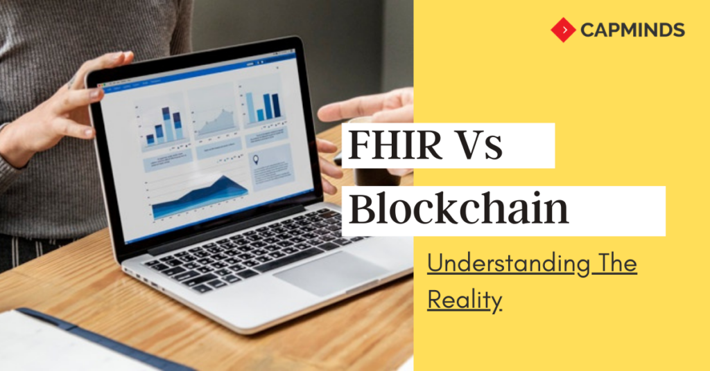The laptop displays a data analysis of FHIR and blockchain in a graph presentation