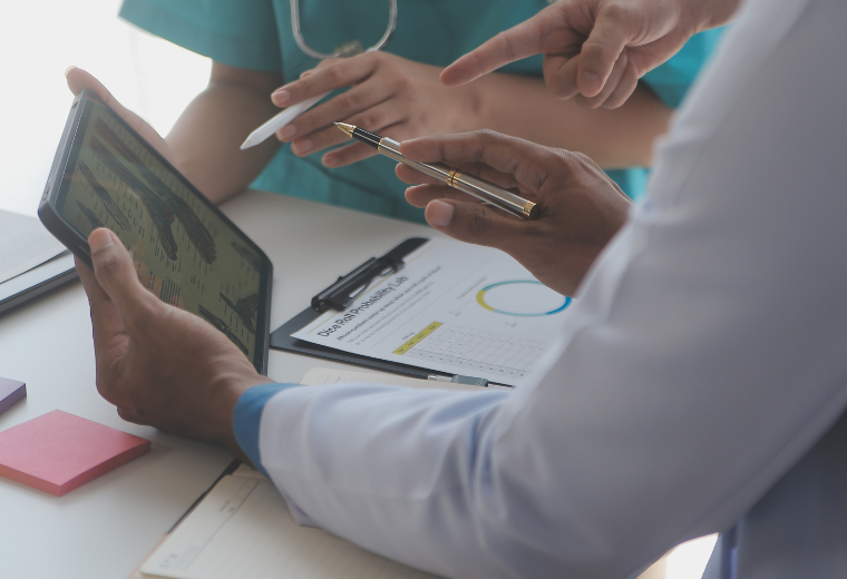 concentrated-medical-team-using-laptop-together-office